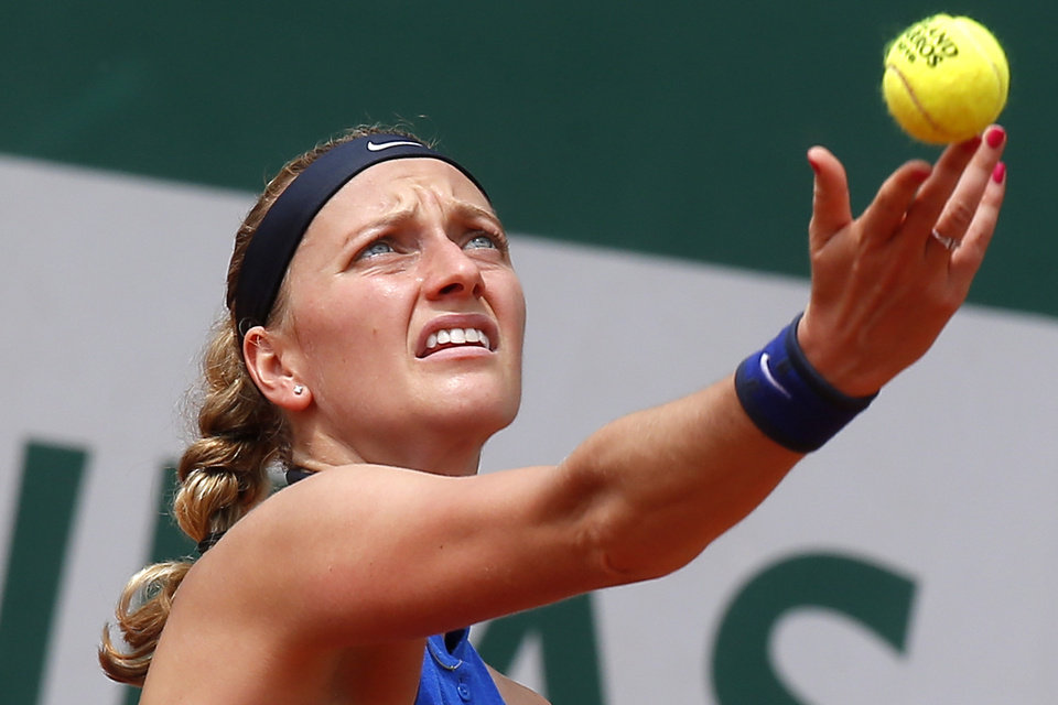 FILE - In this May 27, 2016 file photo, Petra Kvitova of the Czech Republic serves in her third round match of the French Open tennis tournament against Shelby Rogers of the U.S. at the Roland Garros stadium in Paris. Two-time Wimbledon champion Petra Kvitova has been injured during an attack in her flat in the Czech Republic. Kvitova’s spokesman Karel Tejkal says Tuesday Dec. 20, 2016 Kvitova suffered a left hand injury and has been treated by doctors. (AP Photo/Michel Euler, File)