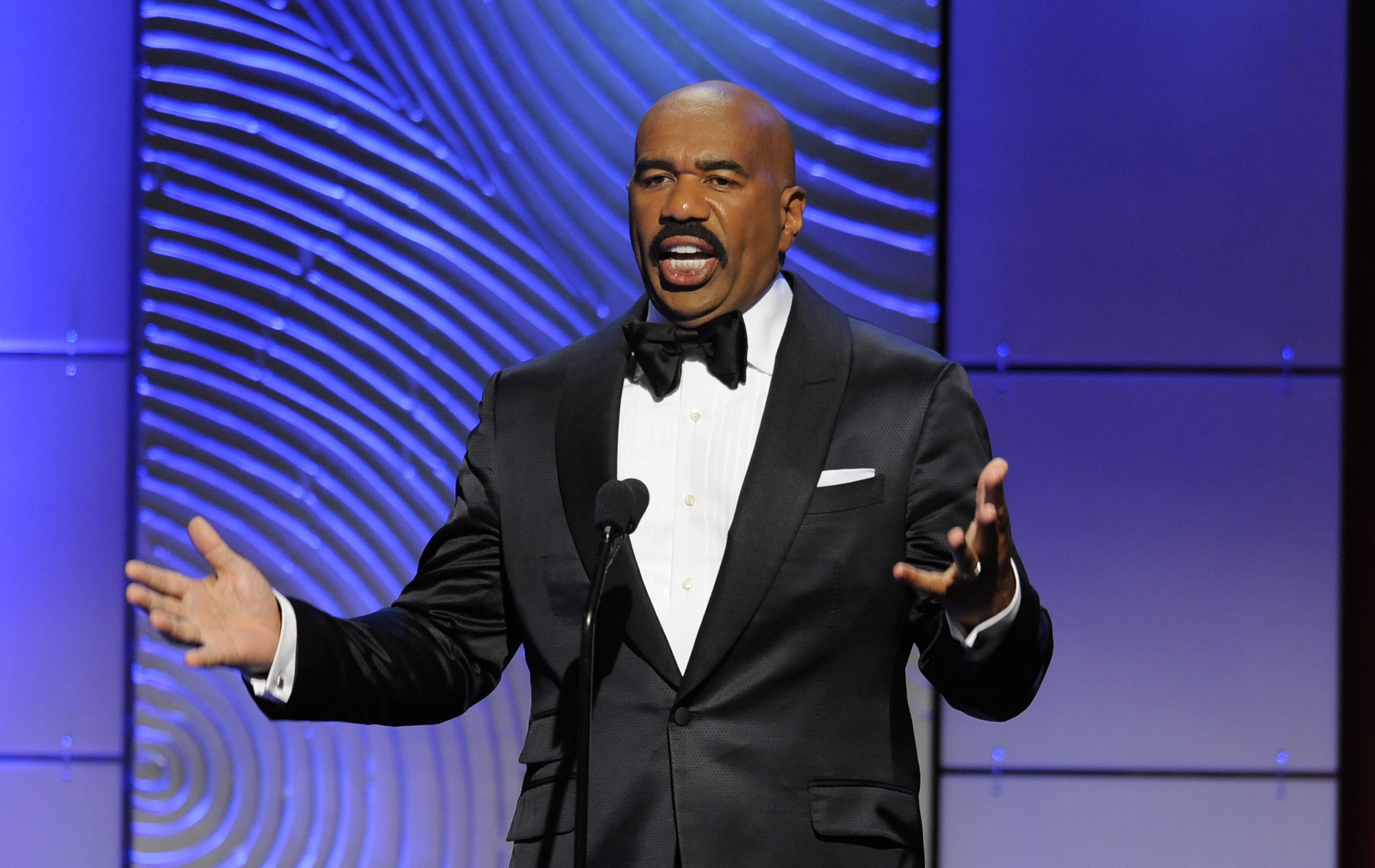 FILE - In this June 16, 2013 file photo, Steve Harvey speaks on stage at the 40th Annual Daytime Emmy Awards in Beverly Hills, Calif. NBC's new series, "Little Big Shots," led the network to a ratings victory during its first week on the air, the Nielsen company said, Tuesday, March 15, 2016. The comic Harvey is the host as talented youngsters _ a 6-year-old spelling champ, a 4-year-old basketball phenom, a 6-year-old choir conductor, display their abilities.(Photo by Chris Pizzello/Invision/AP)
