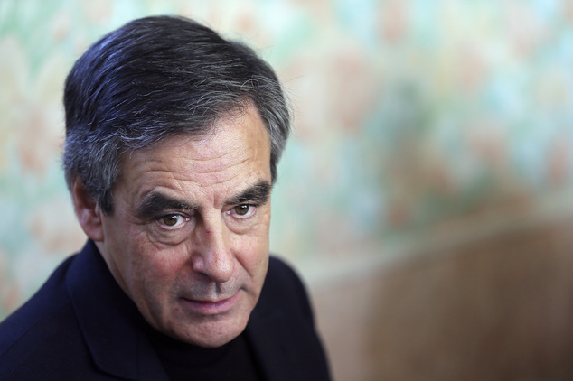 FILE - In this Dec. 1, 2016 file photo, conservative presidential candidate Francois Fillon visits a farm in Chantenay-Villedieu, western France. France's presidential campaign is heating up, as candidates from the anti-immigrant far right to the Trotskyist far left join the race for election five months away. (AP Photo/David Vincent, File)